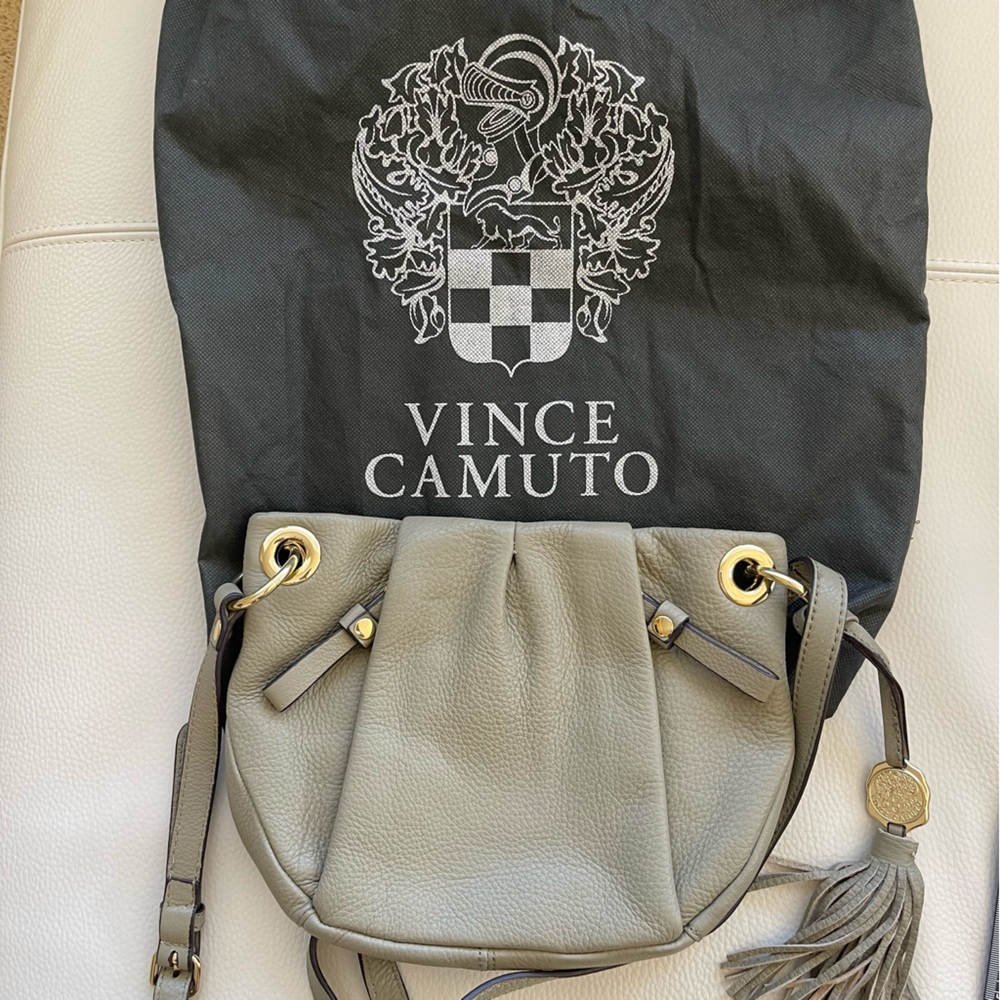 Vince Camuto crossbody bag in taupe leather.